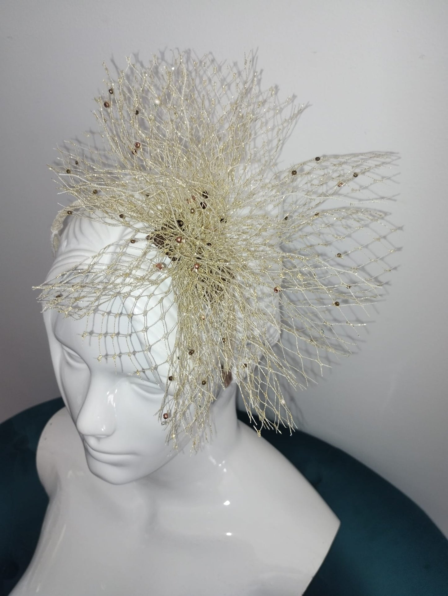 Gold net fascinator with beads