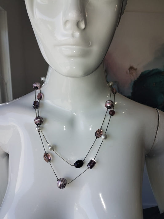 Varied purple beads on silver chain