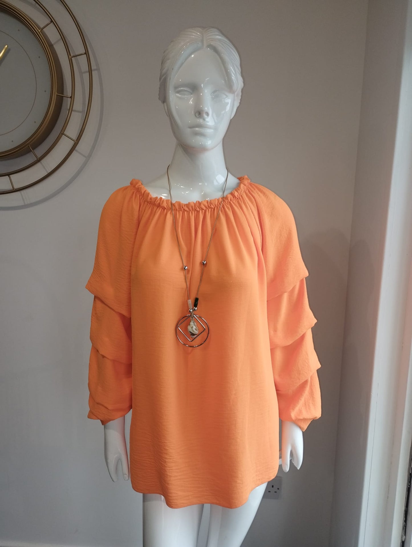 Orange blouse with necklace